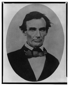 Headshot of Abraham Lincoln, clean-shaven.