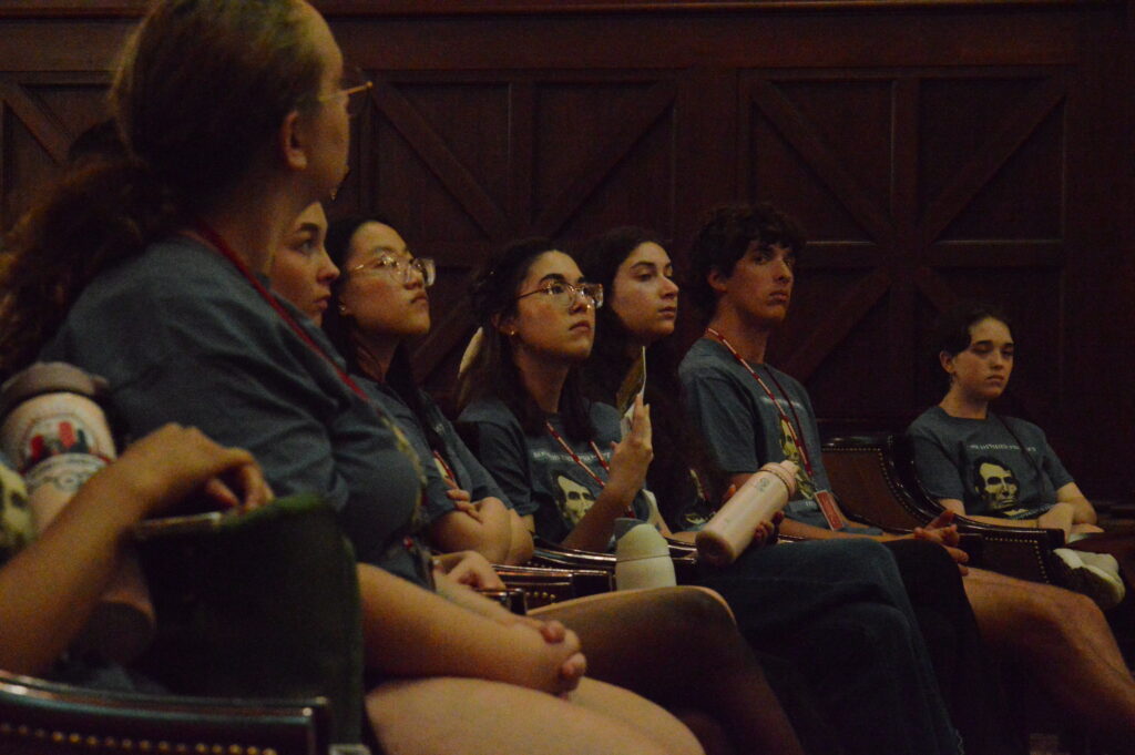 Seven students sitting in a row