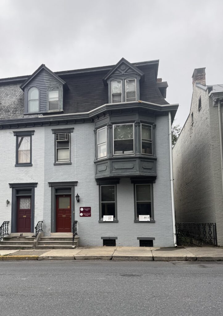 Grey townhouse with red door