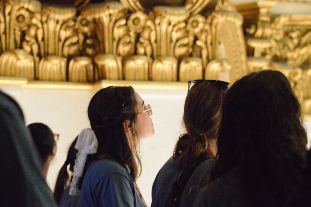 Students looking at ornate architecture