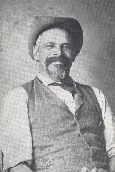 black and white photo, man in hat with beard