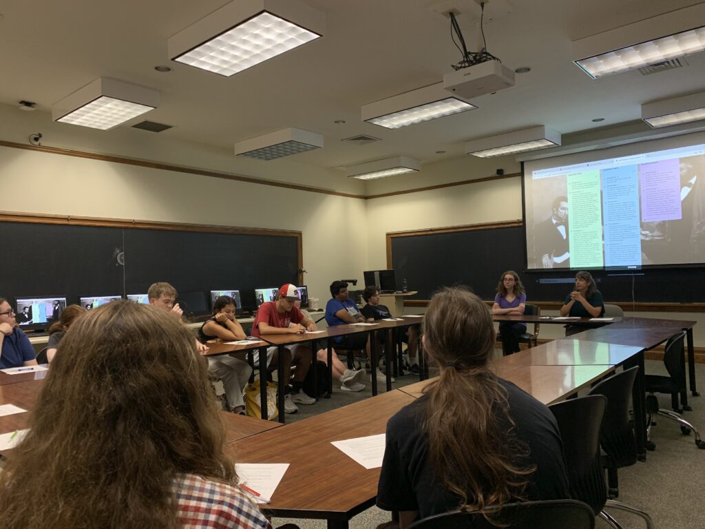 Librarians meeting with students in classroom