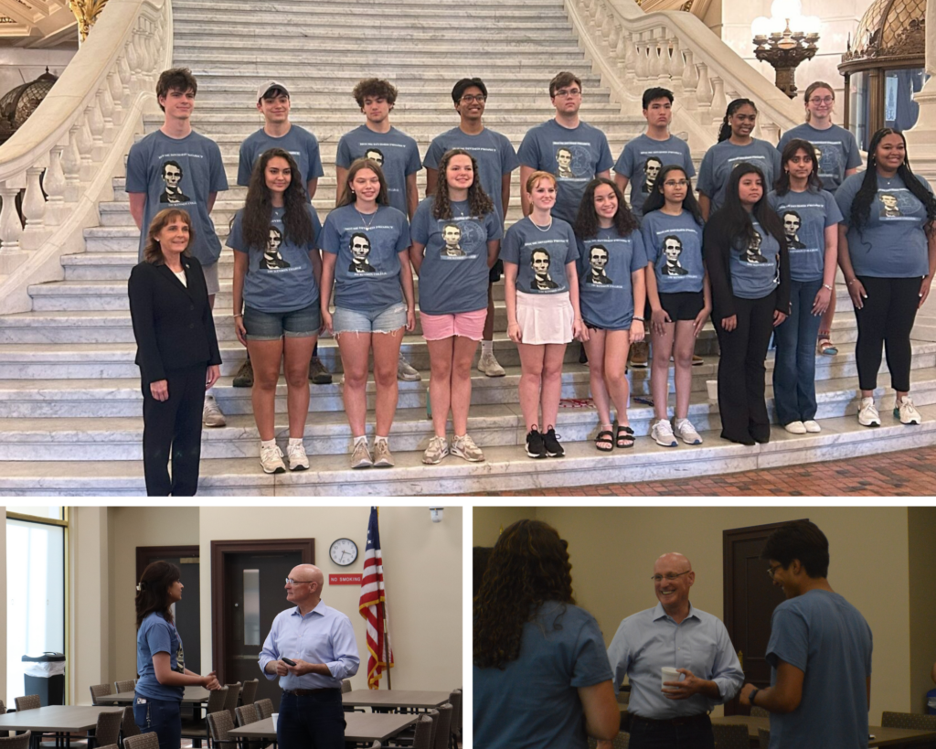 students in blue meeting state representatives