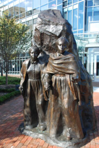 two women, bronze statute